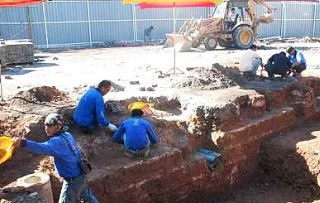 Image: Work on the tower project has been stopped so that workers from the Museums Department can determine the status of the ancient wall."