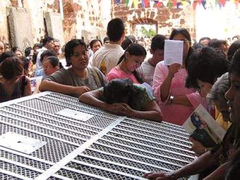 Image: Devotees praying at the empty tomb of St Francis Xavier."