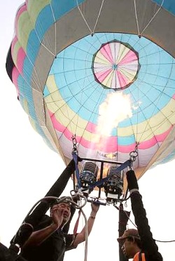 Image: The hot-air balloon being fired up during the media preview for the Putrajaya International Hot Air Balloon Fiesta 2009 taking place in March."
